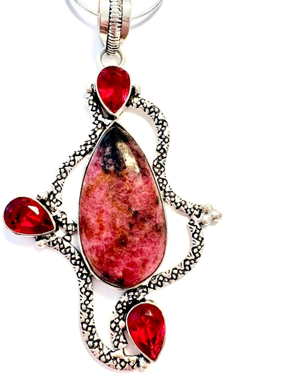 3 inch, Rhodonite and Garnet, 925 marked pendant,  on a silver chain.